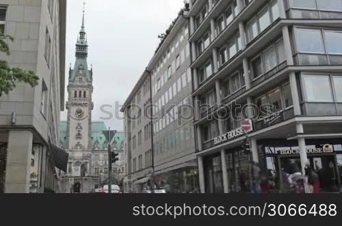 Cityscape time lapse with Rathaus. City traffic, pedestrians on June, 02, 2012 in Hamburg, Germany.