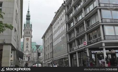 Cityscape time lapse with Rathaus. City traffic, pedestrians on June, 02, 2012 in Hamburg, Germany.