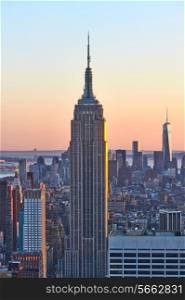 Cityscape view of Manhattan with Empire State Building, New York City, USA at sunset