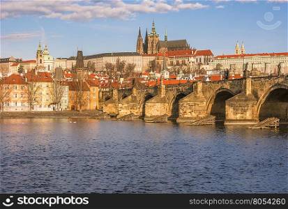 Cityscape with a section of the Charles Bridge and the river Vltava, which crosses Prague, Czech Republic.