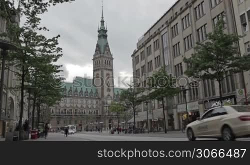 Cityscape with City hall, Rathaus. City traffic and pedestrians. City life, urban scene on June, 02, 2012 in Hamburg, Germany.