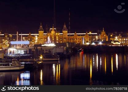 Cityscenic from Amsterdam in the Netherlands by night with the central station