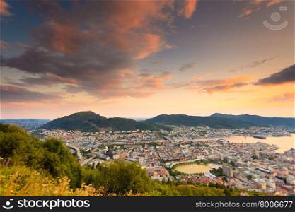 Cityspace. Panoramic view from hill of whole Bergen and fjord landscape sunset scenery, Norway