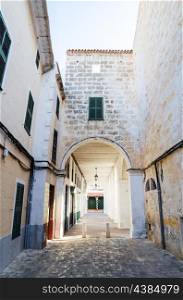 Ciutadella old town narrow street with archway, Menorca, Spain.