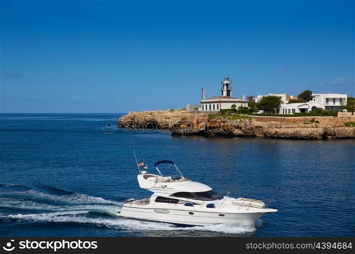 Ciutadella Sa Farola Lighthouse with yatch boat in Balearic islands