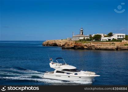 Ciutadella Sa Farola Lighthouse with yatch boat in Balearic islands