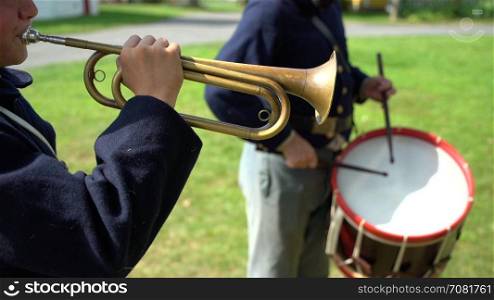 Civil War bugler playing with drummer