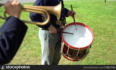 Civil War drummer plays with bugler