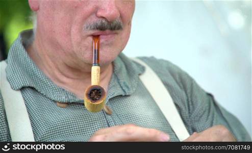 Civil War soldier lighting tobacco pipe