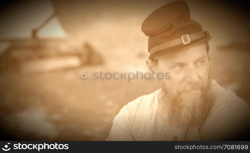 Civil War soldier sitting alone in camp (Archive Footage Version)