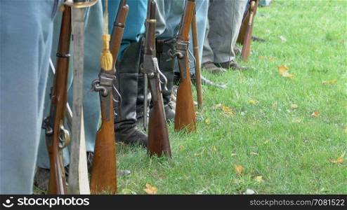 Civil War soldiers feet and guns in a row