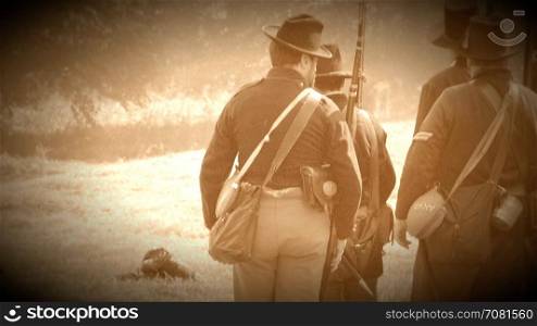 Civil War soldiers shooting across battlefield (Archive Footage Version)