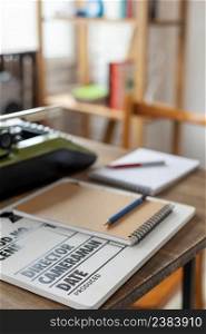 Clapper board and vintage typewriter at wooden desk table. Writer or screenwriter creative concept