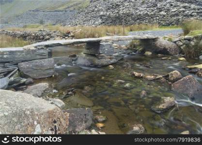 Clapper bridge over stream, hanging valley of Cwmorthin, Tanygriseau, Blaenau Ffestiniog, Wales, United Kingdom, Europe