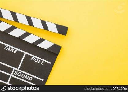 clapperboard yellow background