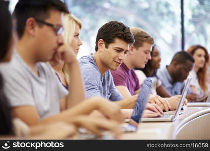 Class Of University Students Using Laptops In Lecture