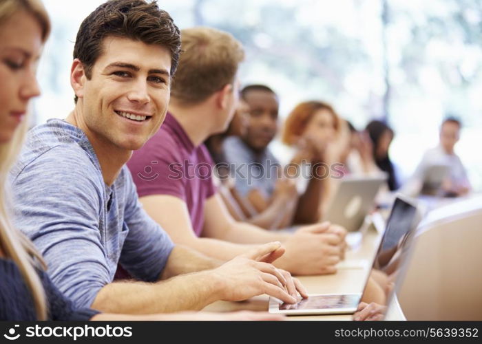 Class Of University Students Using Laptops In Lecture