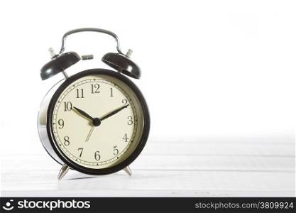 Classic alarm clock with white background
