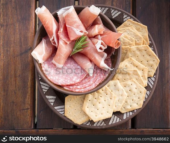 Classic antipasto food platters typical of the Mediterranean including salami and crackers