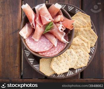Classic antipasto food platters typical of the Mediterranean including salami and crackers