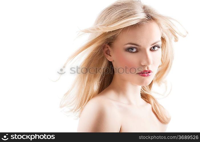 classic beauty portrait of young sexy girl with hairstyle and flying hair from wind, she is turned of three quarters and looks in to the lens