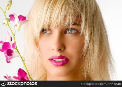classic beauty style portrait of blond girl with flowers