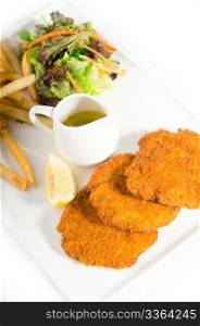 classic breaded Milanese veal cutlets with french fries and vegetables on background ,MORE DELICIOUS FOOD ON PORTFOLIO