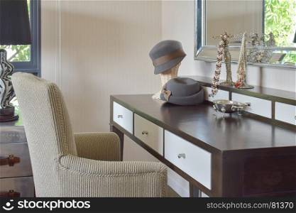 classic brown chair with jewelry set on dressing table at home