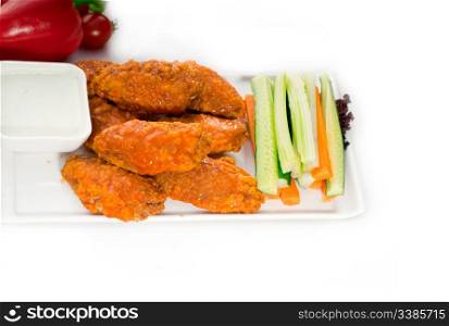 classic buffalo chicken wings served with fresh pinzimonio and vegetables on background,MORE DELICIOUS FOOD ON PORTFOLIO