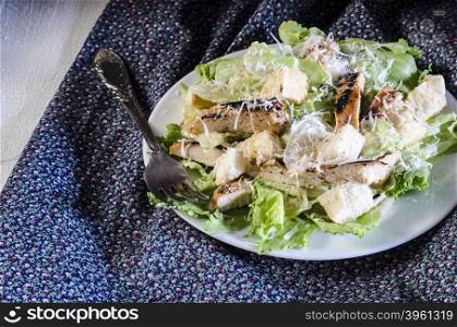 Classic caesar chicken salad on wooden table. Classic caesar chicken salad on wooden table rustic style