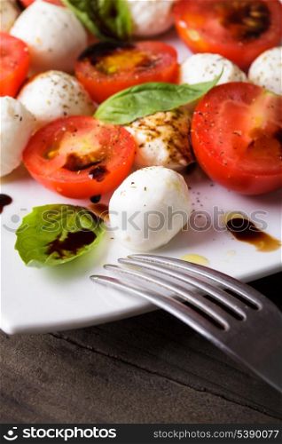 Classic caprese salad closeup on the plate