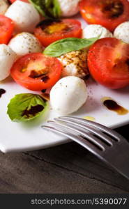 Classic caprese salad closeup on the plate