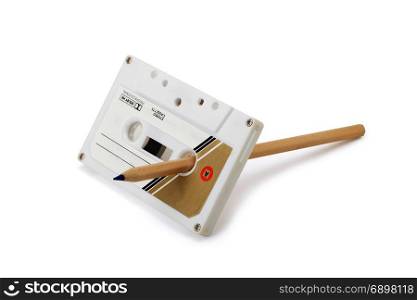 Classic cassette tape Rewind with pencil isolated on white background with path