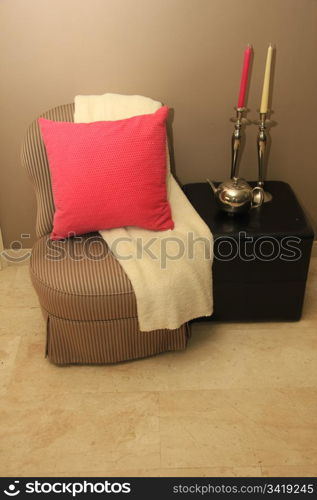 Classic chair and hocker styled with off white and pink accessories
