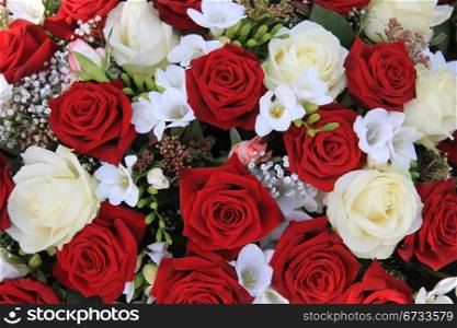 Classic combination of big white and red roses in a bouquet