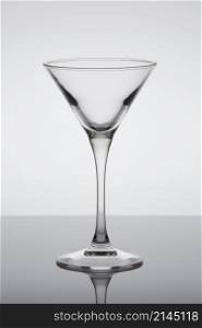 classic contemporary cocktail glass with display on the mirror. classic contemporary cocktail glass