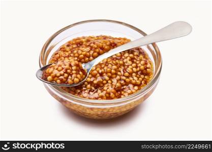 Classic Dijon mustard sauce in glass bowl isolated on white background. High quality photo. Classic Dijon mustard sauce in glass bowl isolated on white background