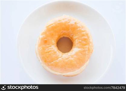 Classic donut serving on white dish, stock photo