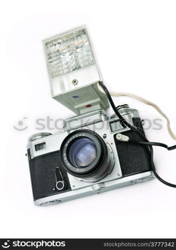 Classic film rangefinder camera with flash isolated on a white background