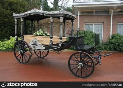 Classic funeral carriage with coffin