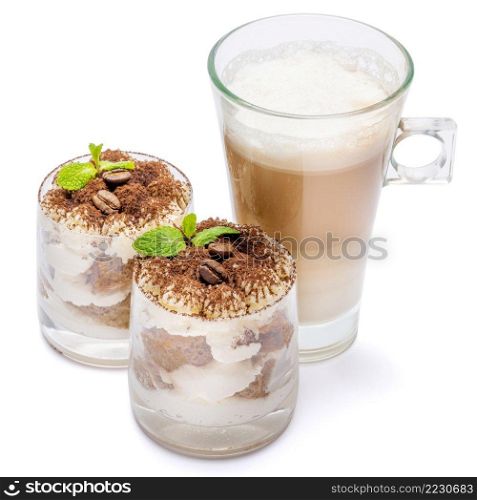 Classic italian tiramisu dessert in a glass and cup of coffee isolated on a white background with clipping path. Classic tiramisu dessert in a glass and cup of coffee isolated on a white background with clipping path