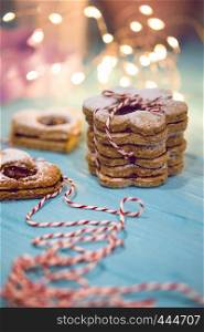 Classic Linzer Cookies close-up and side bokeh in the background, christmas
