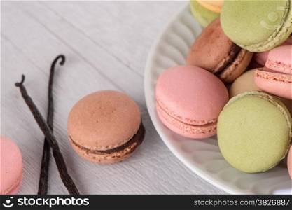 Classic Macarons with Raspberry, Coffee, Chocolate and Pistachios Filled with Cream, French Pastry