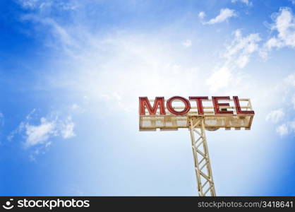 Classic motel sign against blue sky