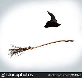 classic pointed witch hat and flying broom flying on a white background. witch flying broom