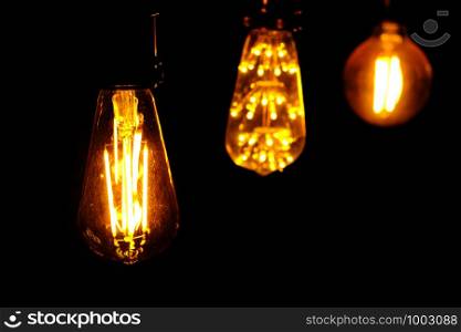Classic retro incandescent led electric lamp on black background,Vintage light bulb