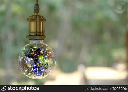 Classic retro incandescent led electric lamp on burred background, Vintage light bulb