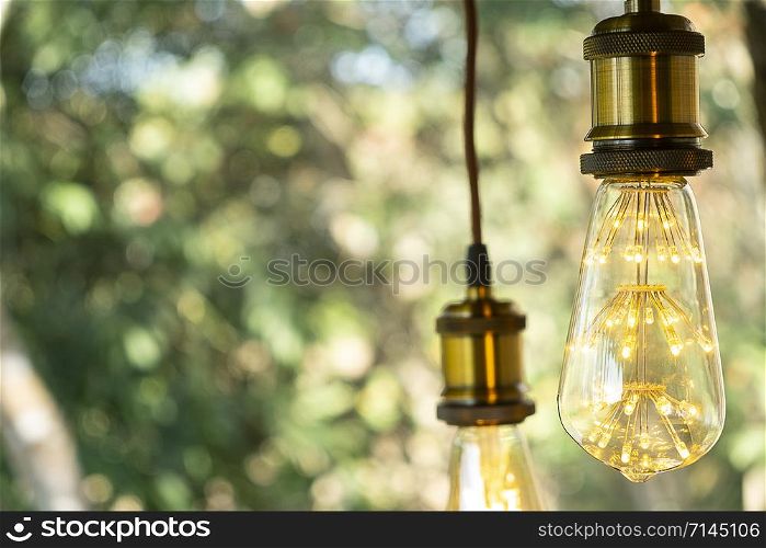 classic retro incandescent led electric lamp warm white on blur background, Vintage light bulb
