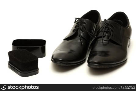 Classic shiny black men&rsquo;s shoes with sponge isolated on white