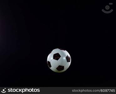 classic soccer football ball isolated on black background